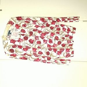 A Karen Scott cardigan style sweater.   Red flowers on white background.